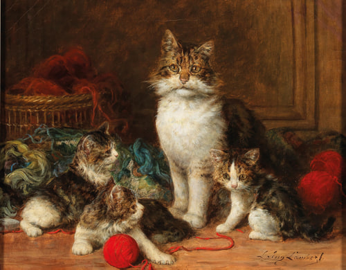 A mother cat and three kittens sit on the floor surrounded by bright red yarn balls.